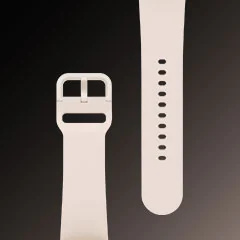 平躺展示的粉金色Galaxy Watch5錶帶，可看見其細節和設計。